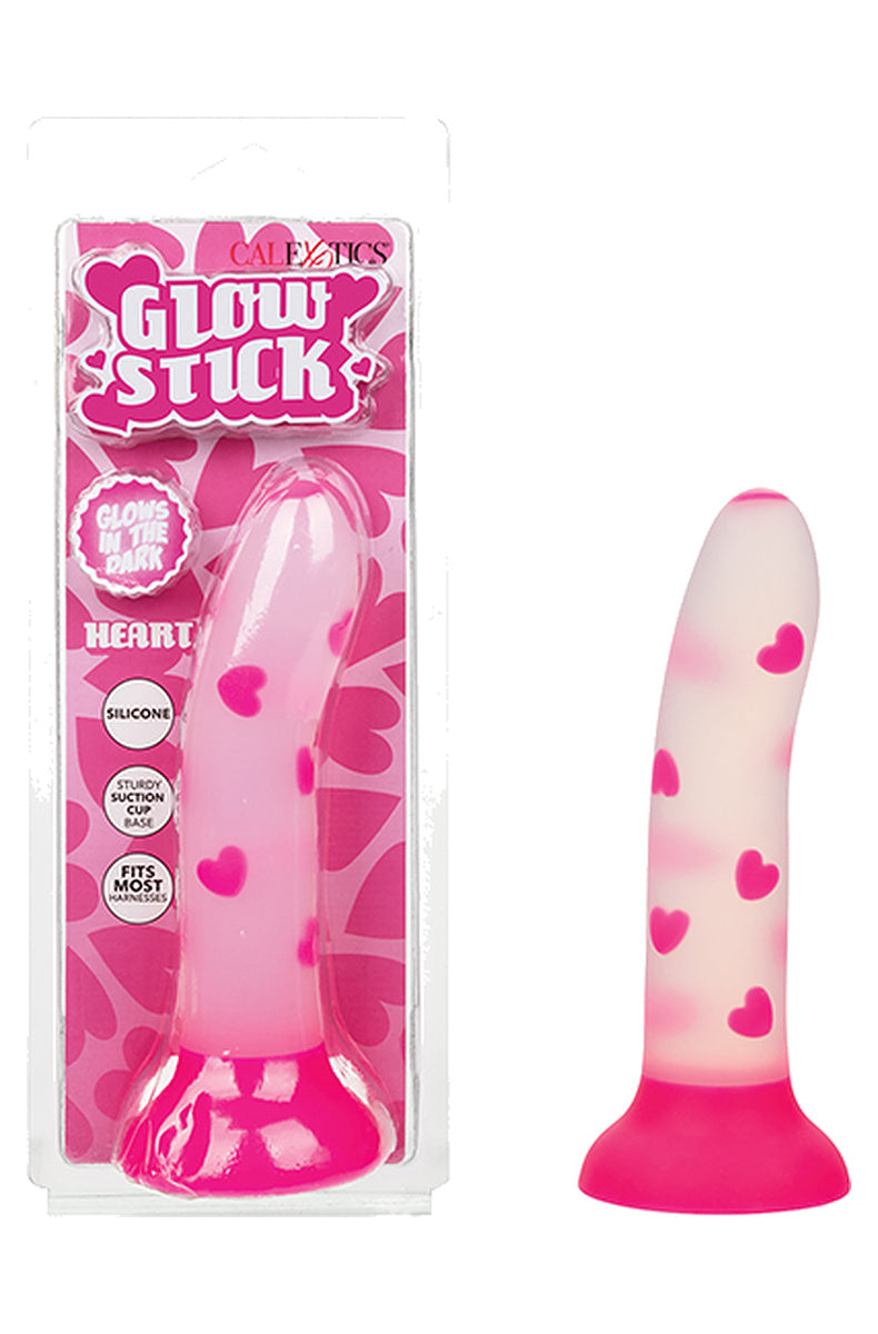 Pink heart glow in the dark dildo next to its retail box