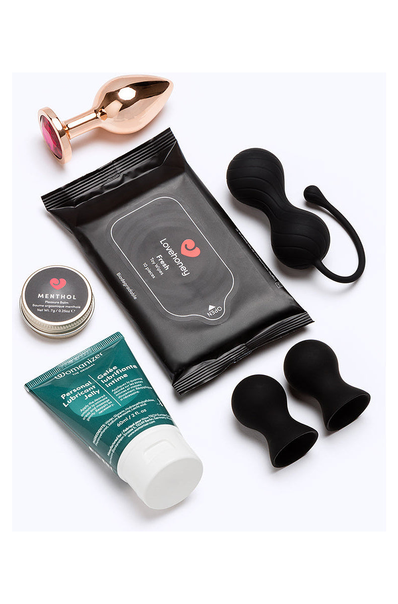 Jeweled butt plug, kegel balls, nipple suckers, menthol balm, lube and toy wipes from the 12 day calendar