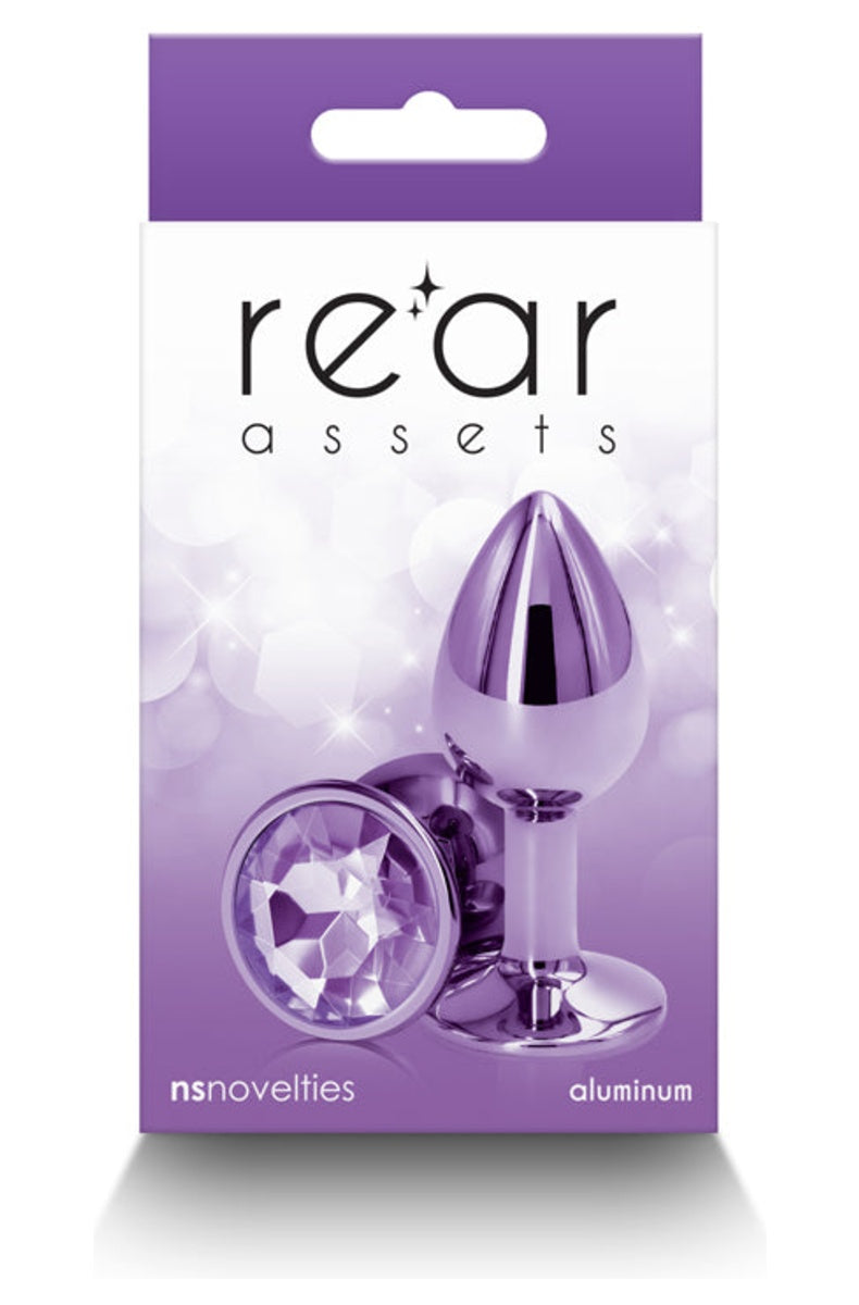 Purple metal butt plug in its retail box, plug and gem base shown on the front