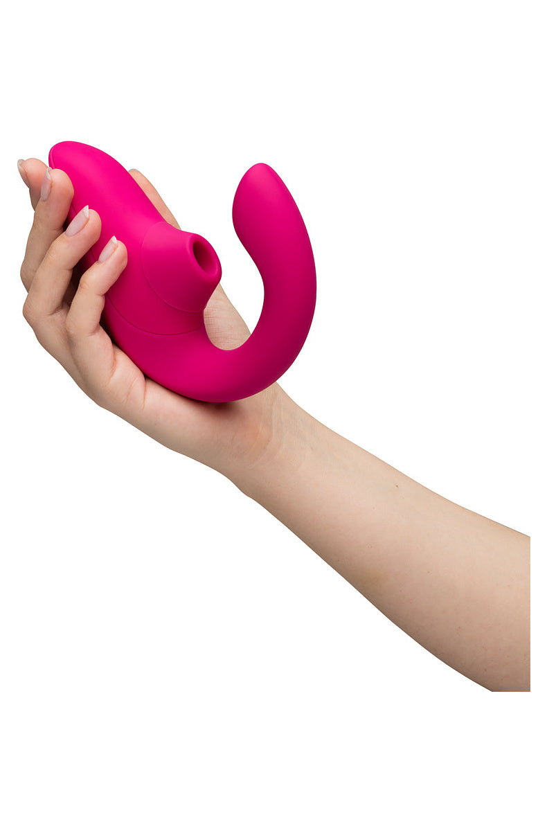 Hand holding the Vibrant Pink Blend, showing its compact size.