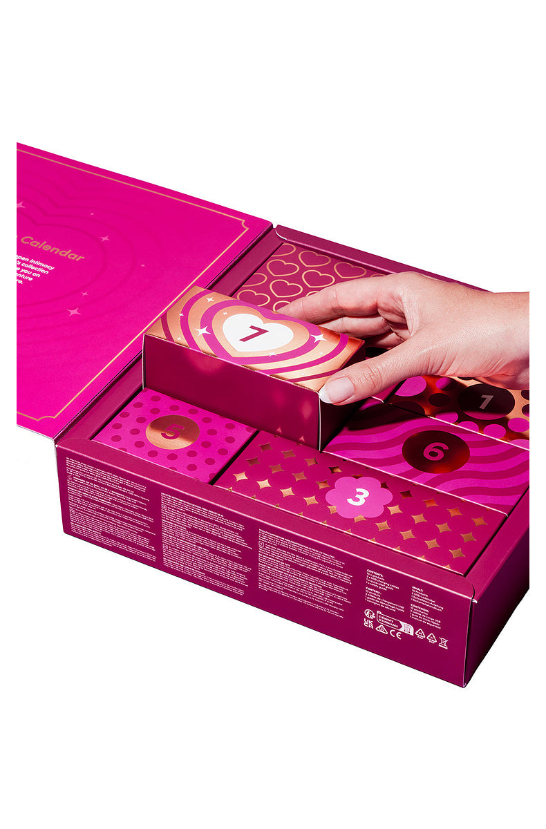 Hand lifting door 7 out of the open 7 day advent calendar