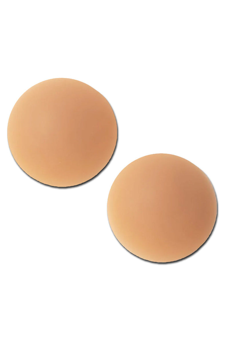Two medium tone round silicone nipple covers side by side