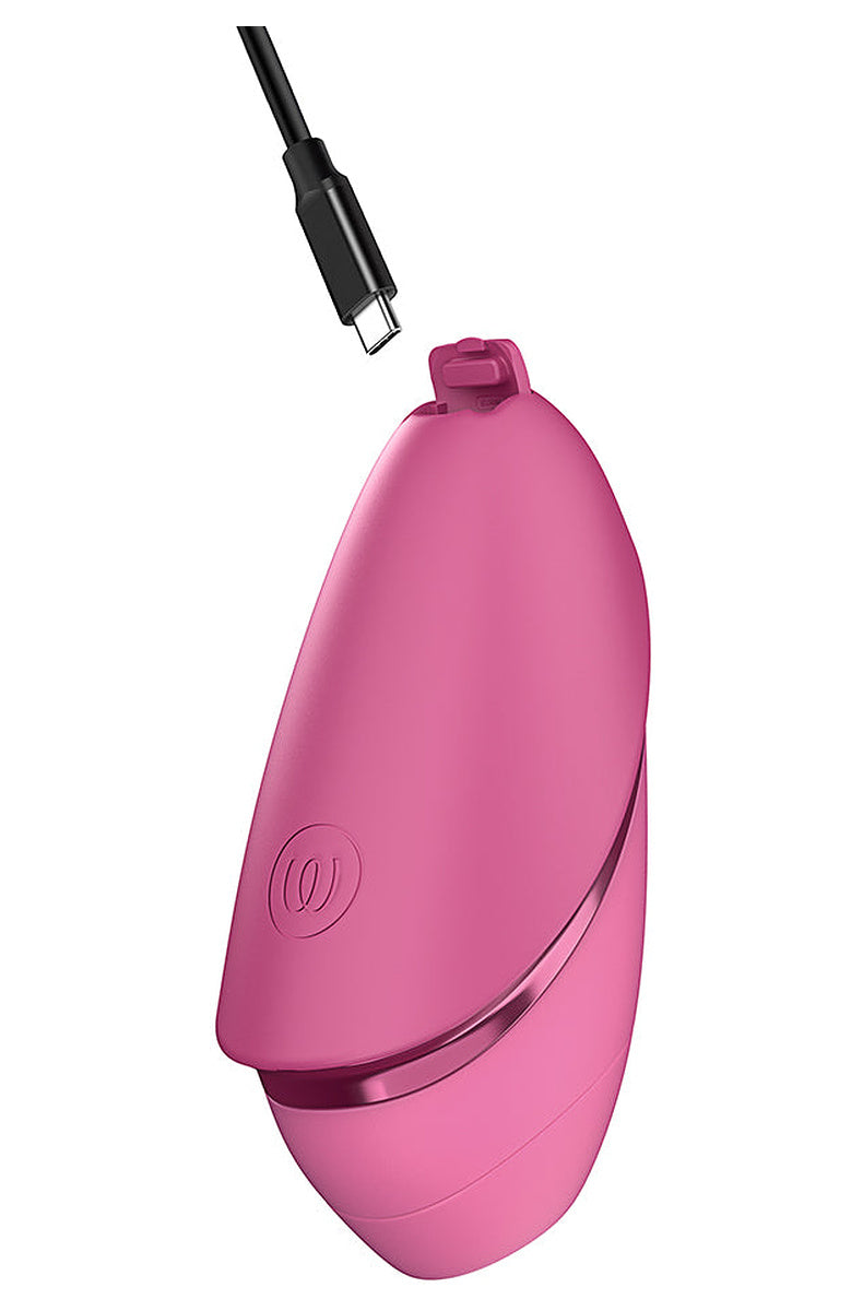 Vibrant Pink Next Liberty with a USB-C cable plugged into the top.