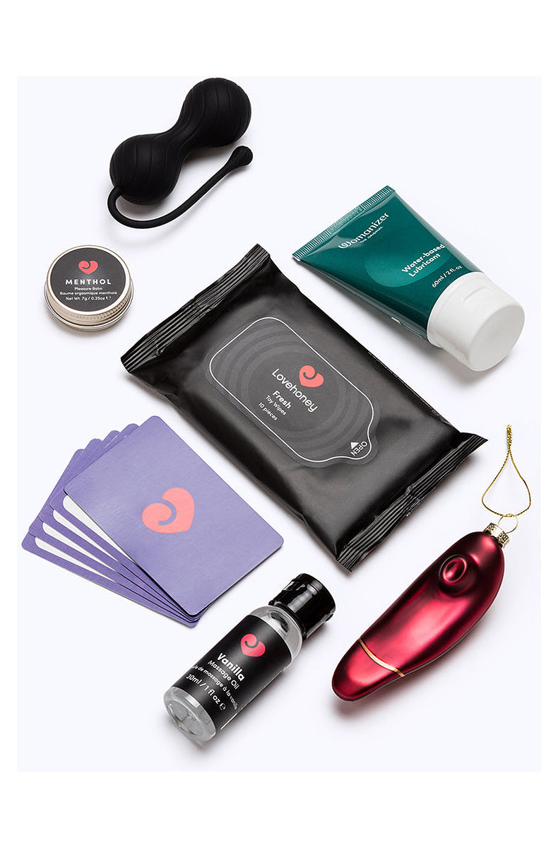 Kegel balls, menthol balm, toy wipes, lube, massage oil, card game and Womanizer ornament