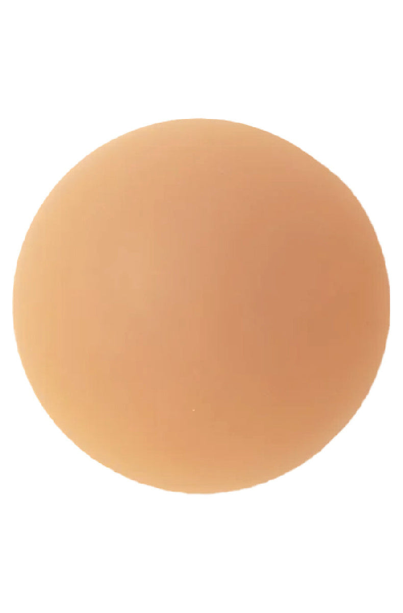 Single medium tone round silicone nipple cover with a thin matte finish