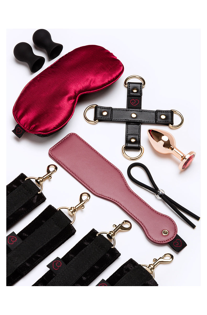 Satin blindfold, wrist and ankle cuffs, hogtie, paddle, nipple suckers, jeweled plug and cock ring lasso