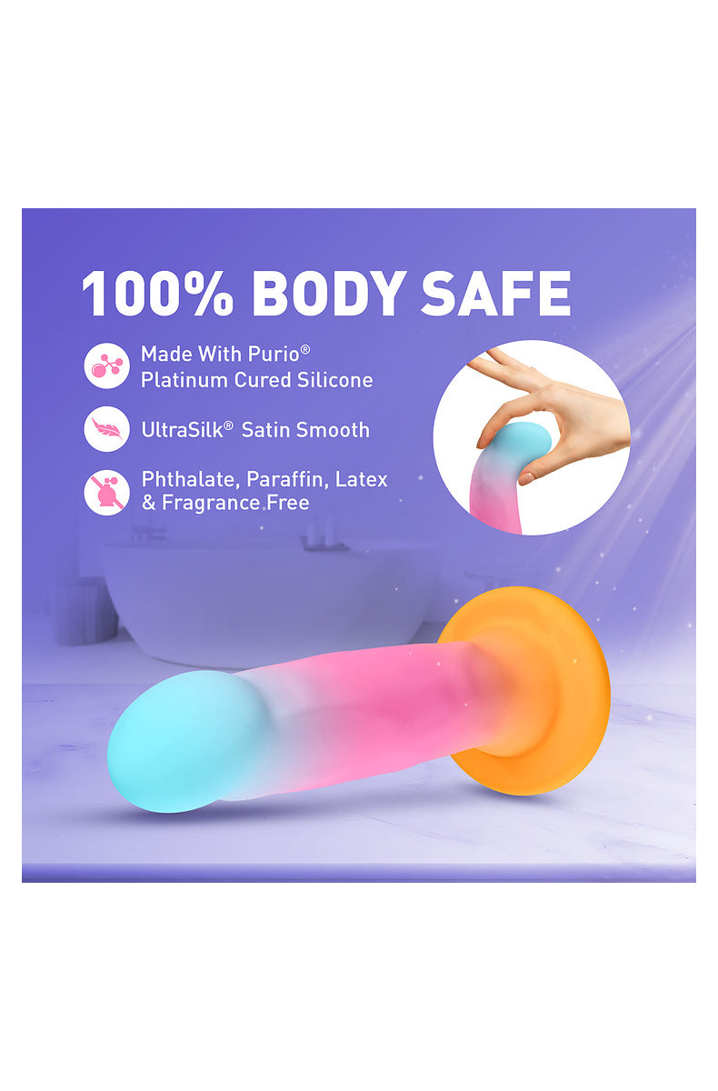 Hand bending the aqua, pink and gold dildo: Purio platinum-cured silicone, phthalate, paraffin, latex and fragrance free