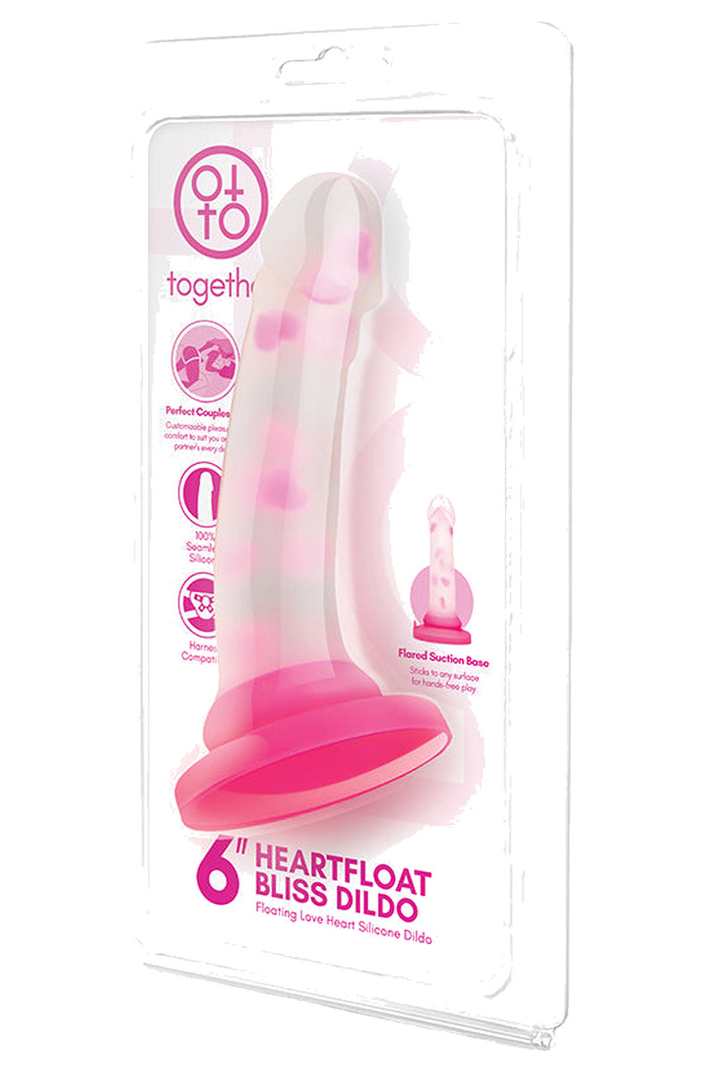 Pink heart dildo in its retail packaging
