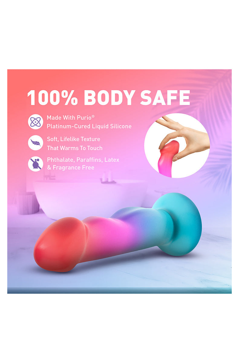 Hand bending the coral, pink and aqua dildo: Purio platinum-cured silicone, phthalate, paraffin, latex and fragrance free