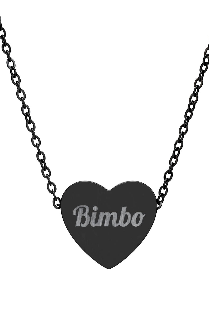 Black heart-shaped pendant necklace with engraved text on a white background