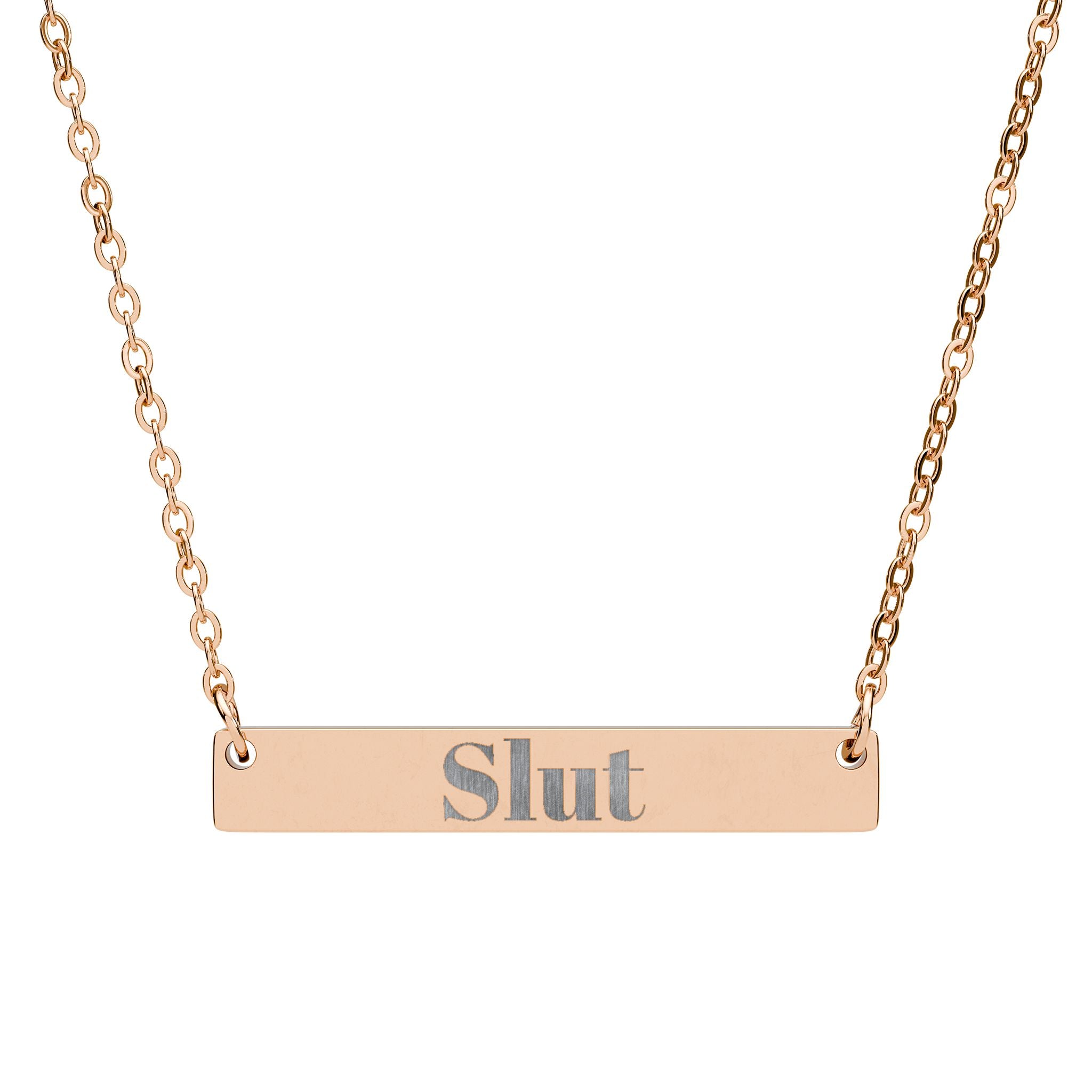 Rose gold necklace with 'Slut' pendant on a white background