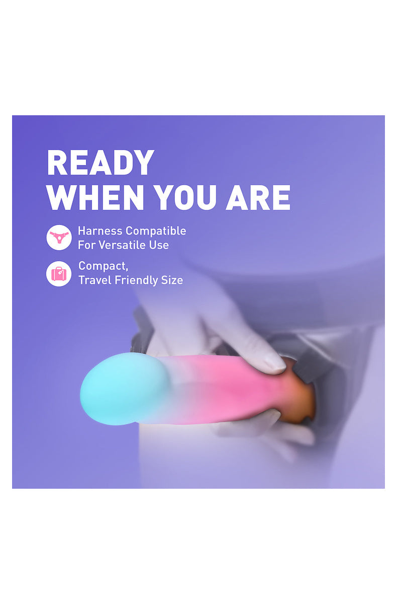 Aqua, pink and gold ombre dildo packed in a suitcase: durable and travel friendly
