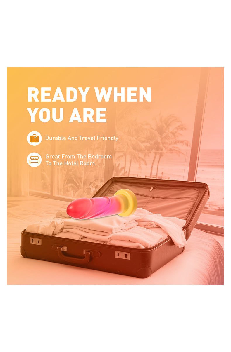 Pink and gold ombre dildo packed in a suitcase: durable and travel friendly