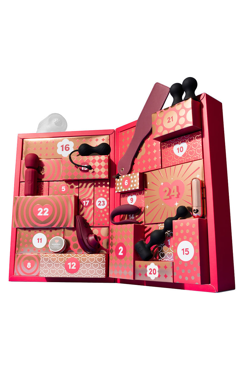 Open couples advent calendar with the Liberty 2, mini wand, bullet and beads in the doors