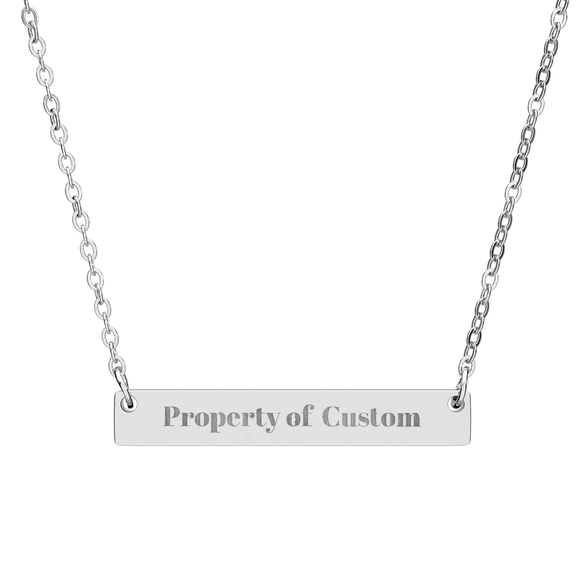 Silver necklace with a bar pendant engraved with 'Property of Custom' on a white background