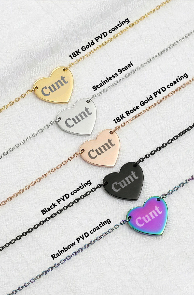 Heart-shaped 'Cunt' pendant on various necklaces with different coatings on a white background