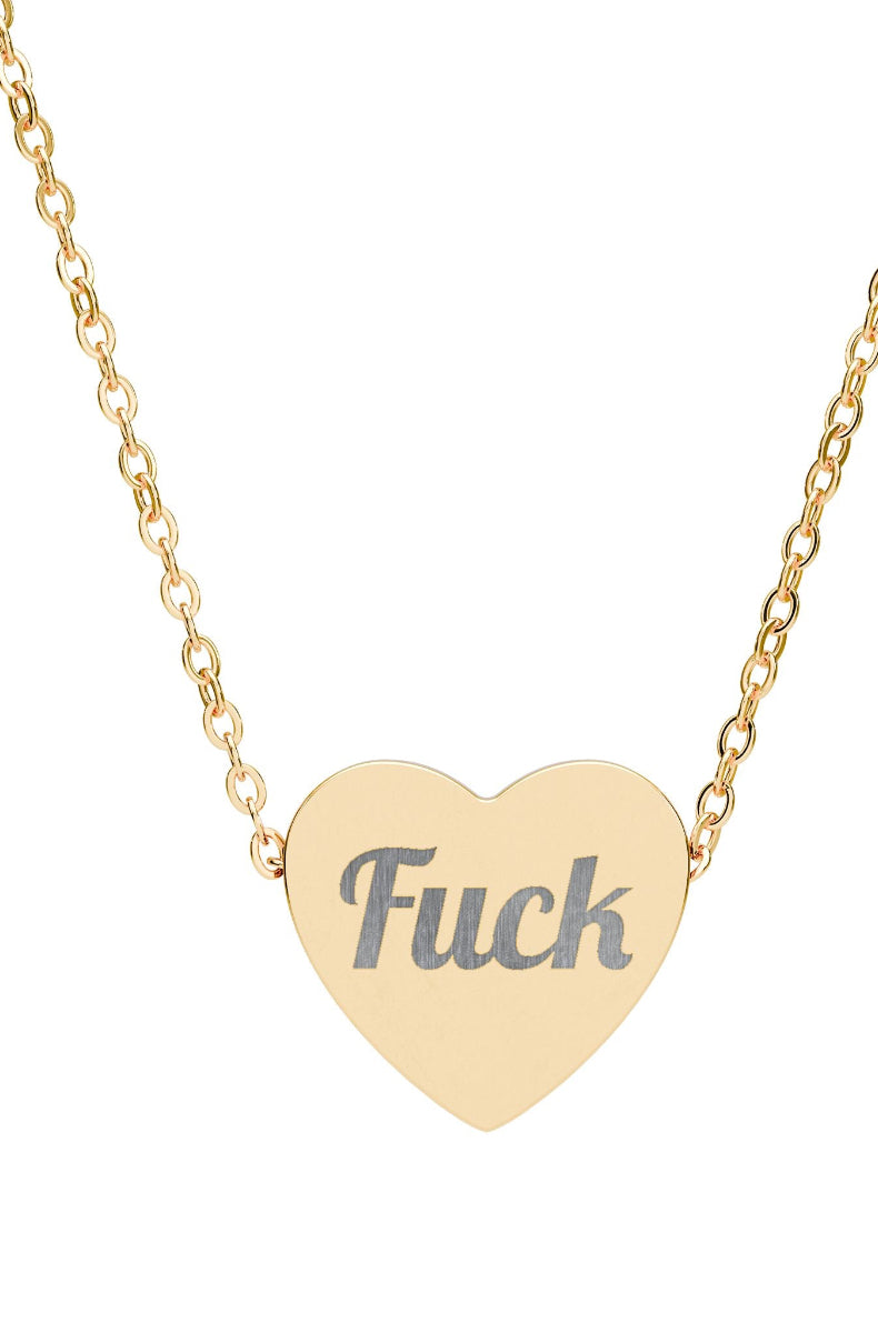 Gold heart-shaped necklace with 'Fuck' engraved on a white background