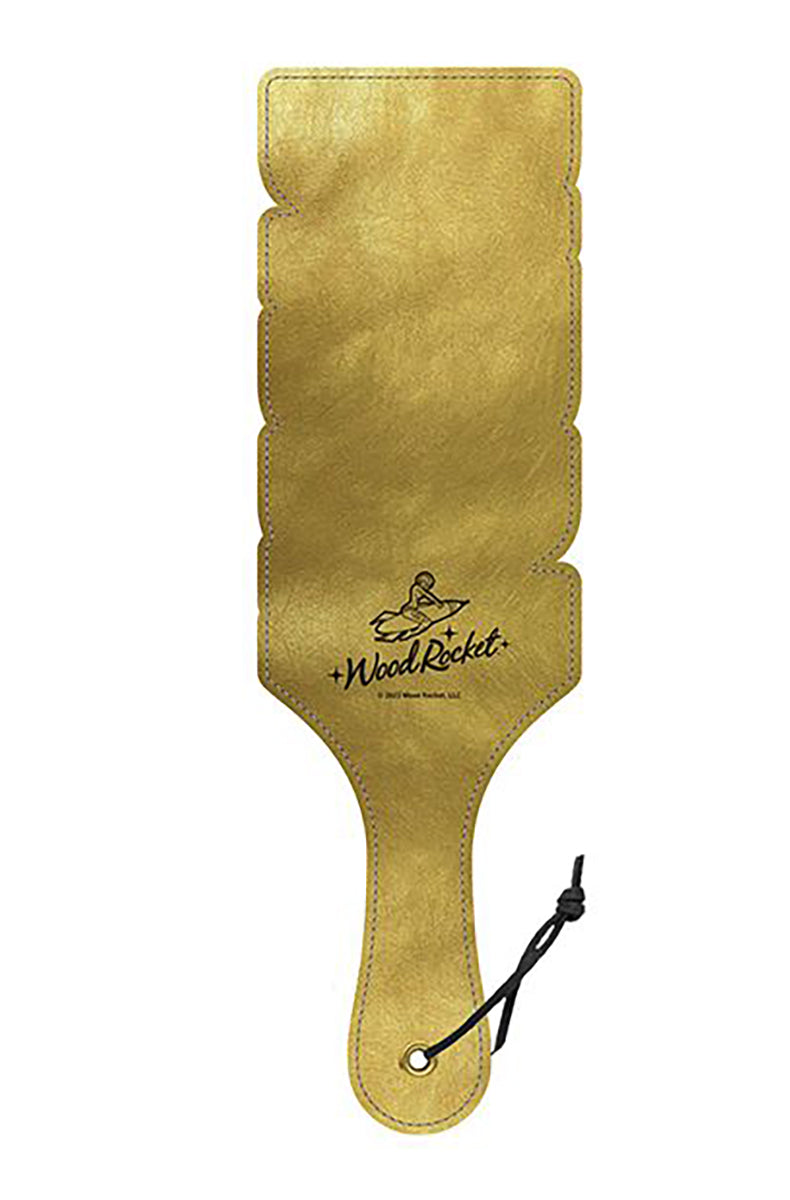 Back view of the gold DADDY paddle showing the stepped letter silhouette with a small Wood Rocket logo in black.