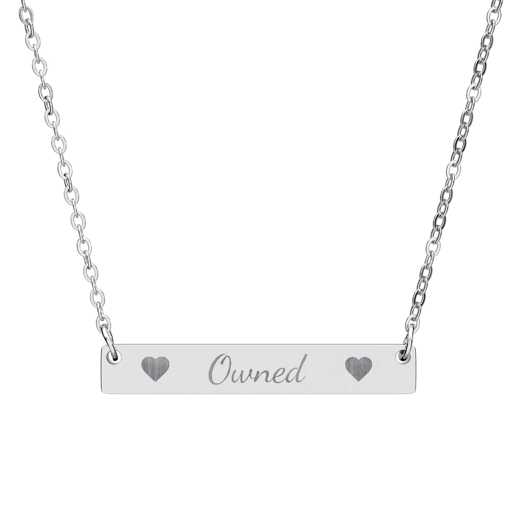 Silver necklace with 'Owned' pendant on a white background