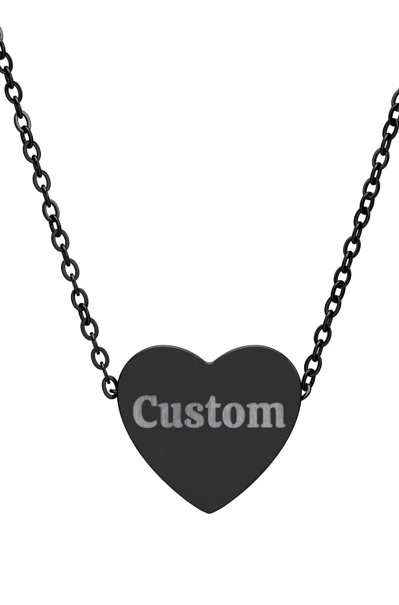 Black heart-shaped pendant with 'Custom' engraving on a chain against a white background