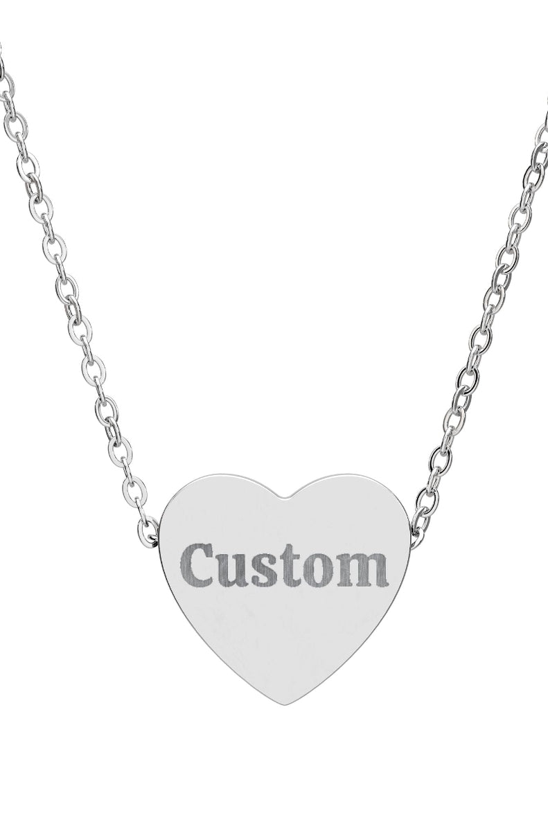 Heart-shaped pendant with 'Custom' engraving on a silver chain against a white background