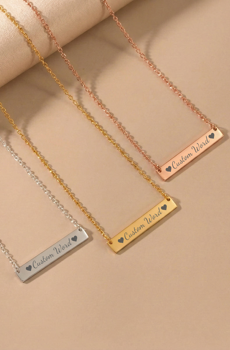 Three custom bar necklaces showing silver, gold, and rose gold finishes with matching cable chains