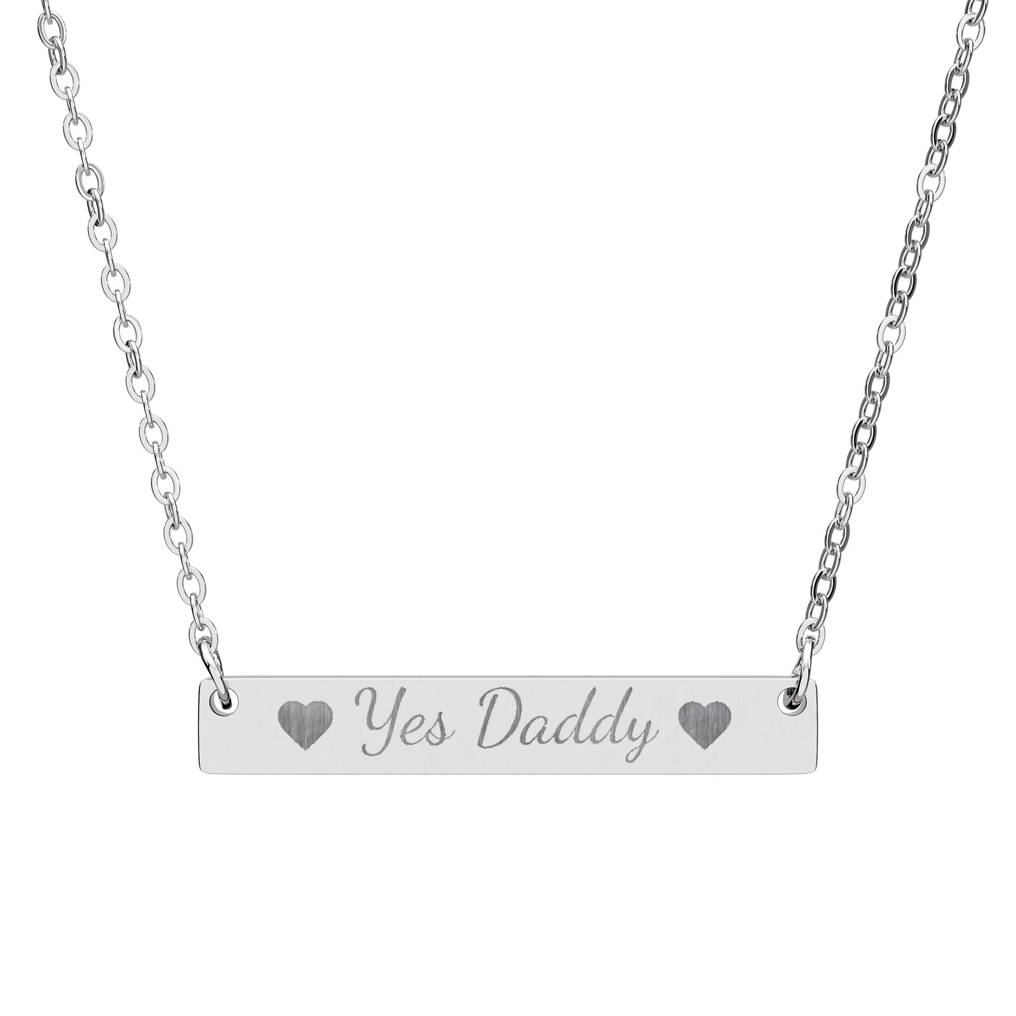Silver necklace with a bar pendant engraved 'yes daddy' on a white background