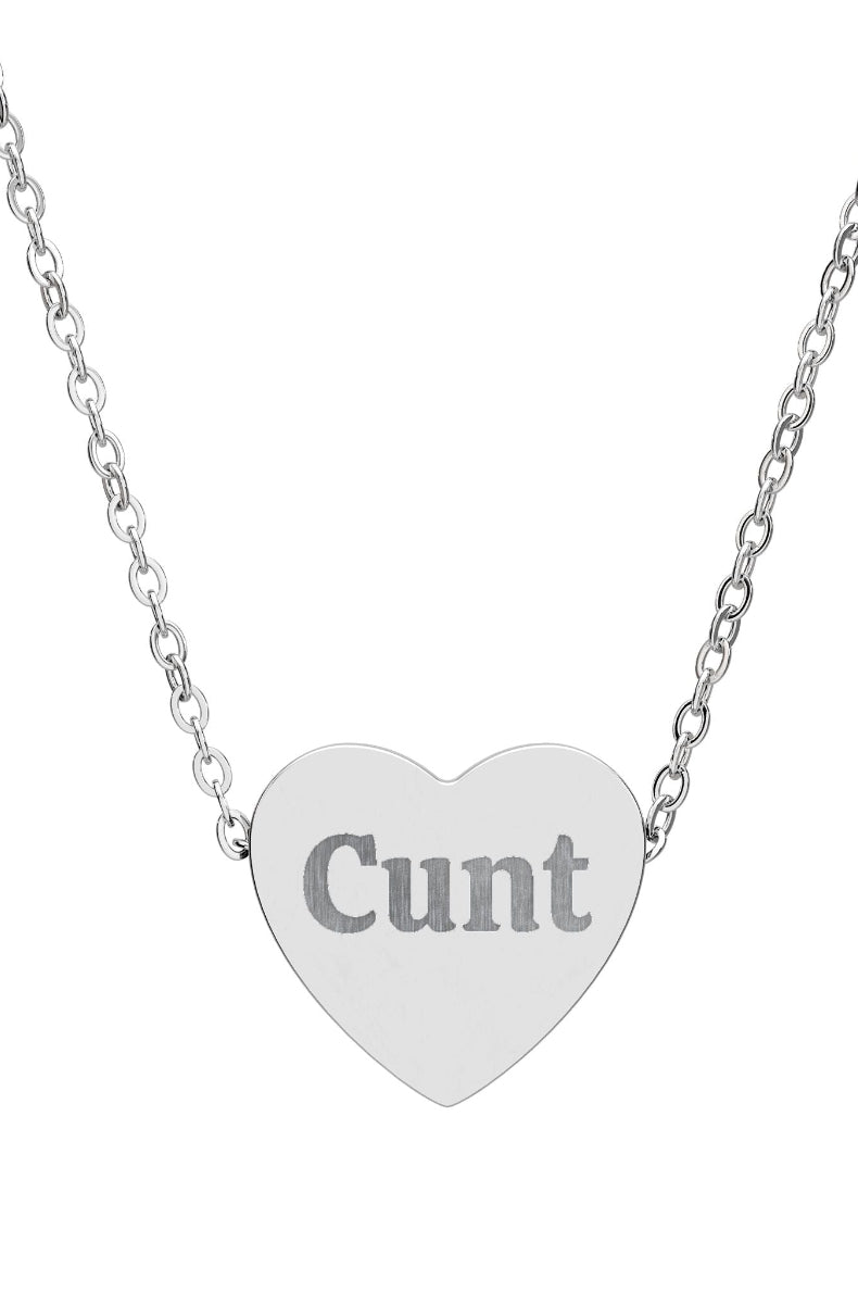 Heart-shaped pendant with engraved text on a silver chain against a white background