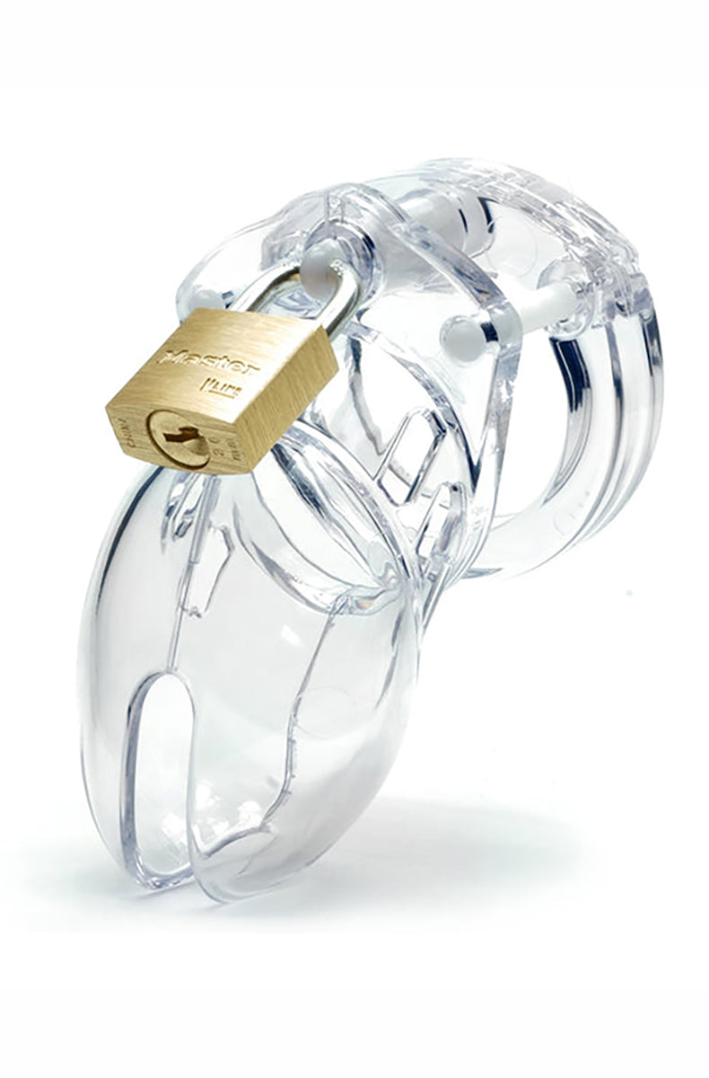 Clear CB-6000S chastity cage with a brass padlock, ventilated cage and flat ring, profile view on white background.