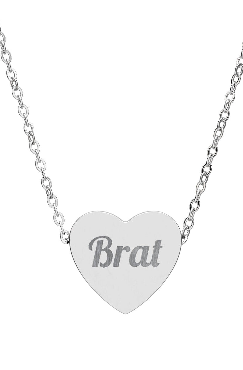 Heart-shaped silver necklace with 'Self Love pretty' engraving on a white background