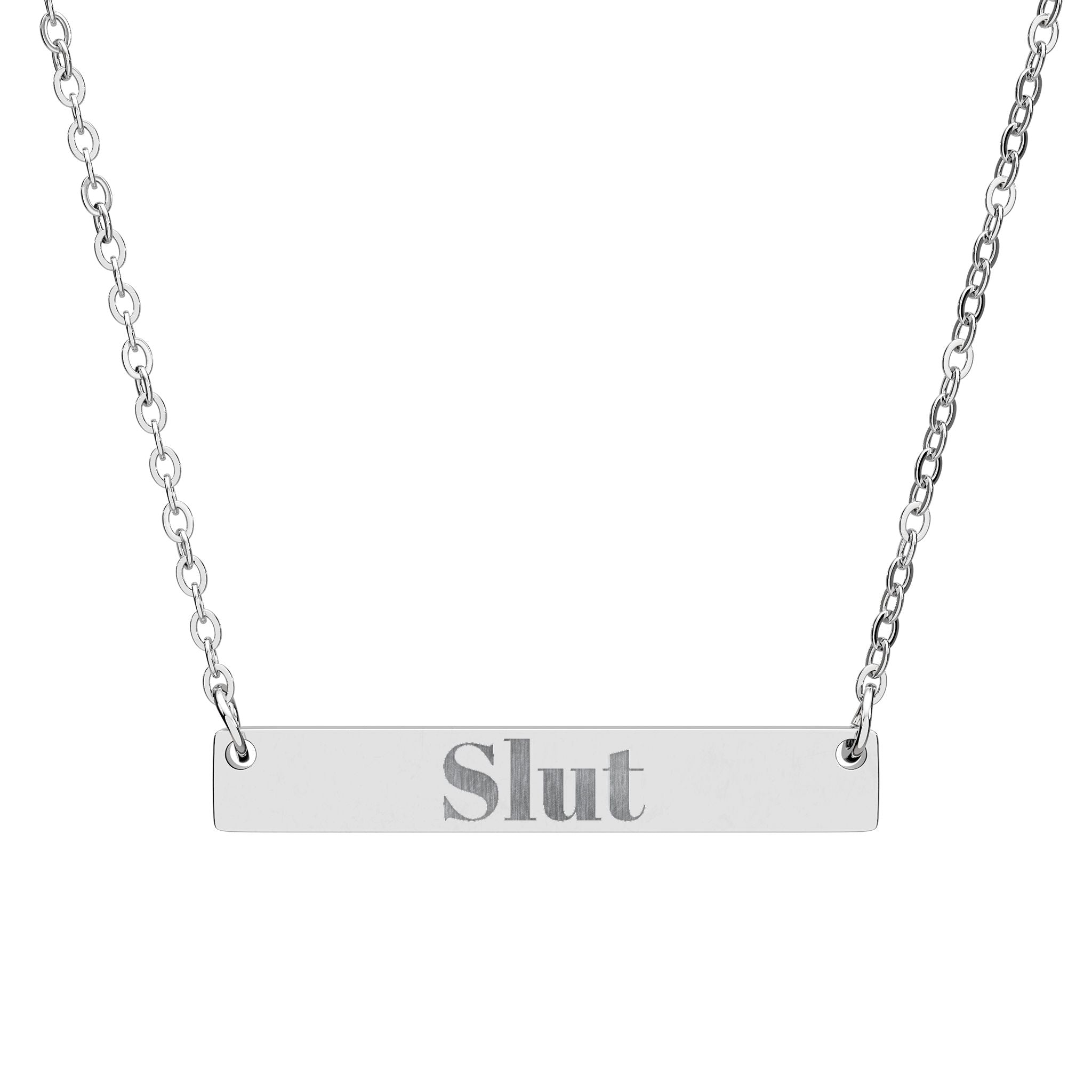 Silver necklace with 'Slut' pendant on a white background