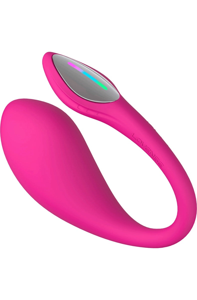 Side view of pink curved vibrator with illuminated LED strip showing colorful light pattern