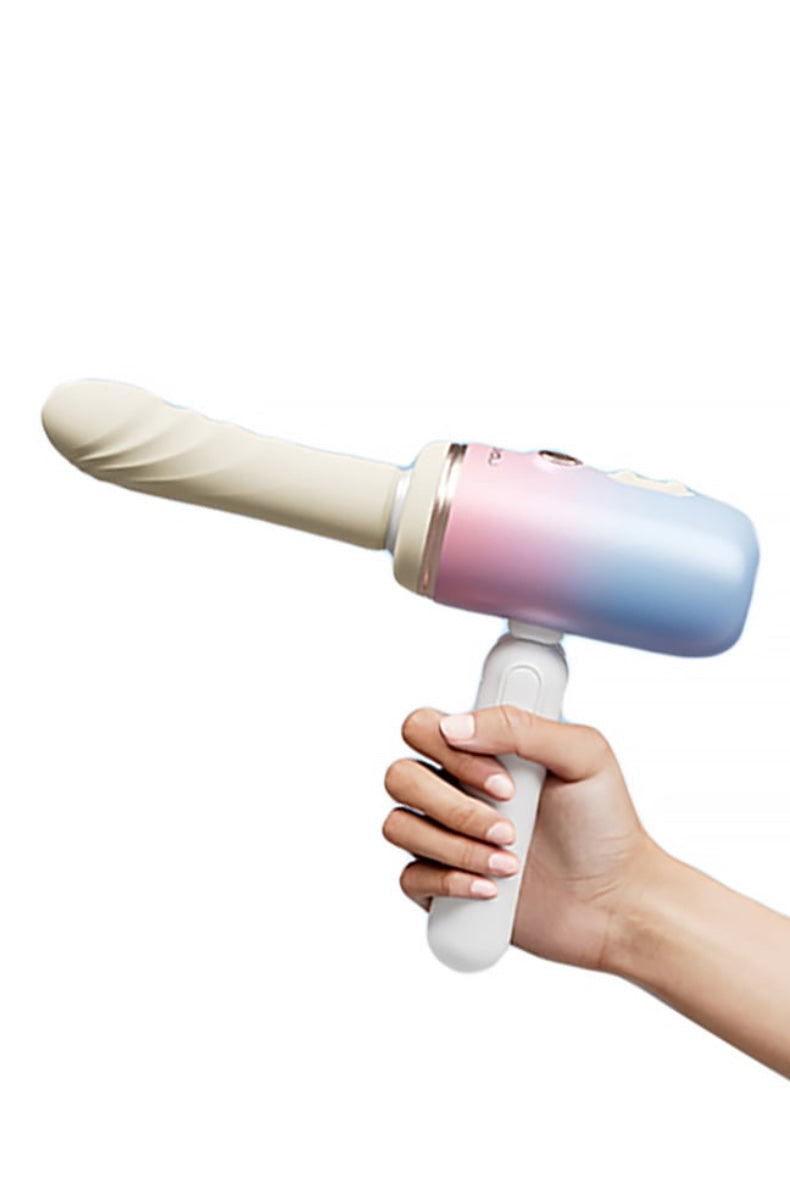 Side view showing thrusting vibrator held in hand with white handle grip