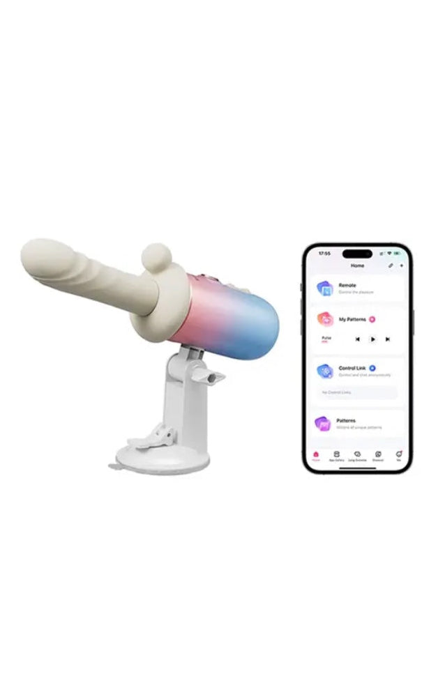 Vibrator on suction cup stand next to smartphone displaying Lovense app interface