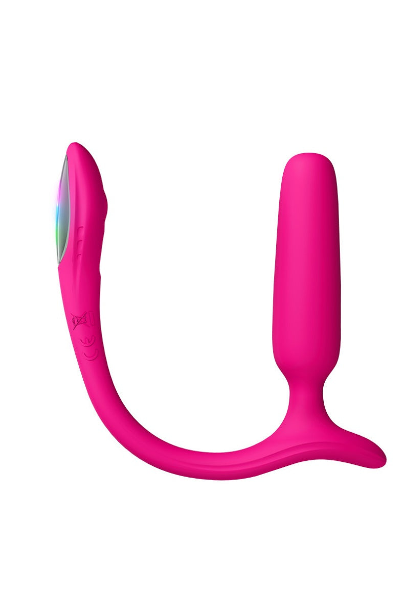 Pink anal plug displaying rainbow LED lights on curved tail section