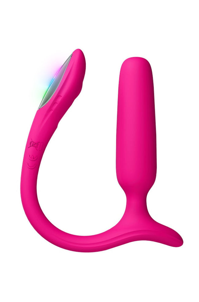 Pink anal plug with illuminated LED tail showing blue and green light colors