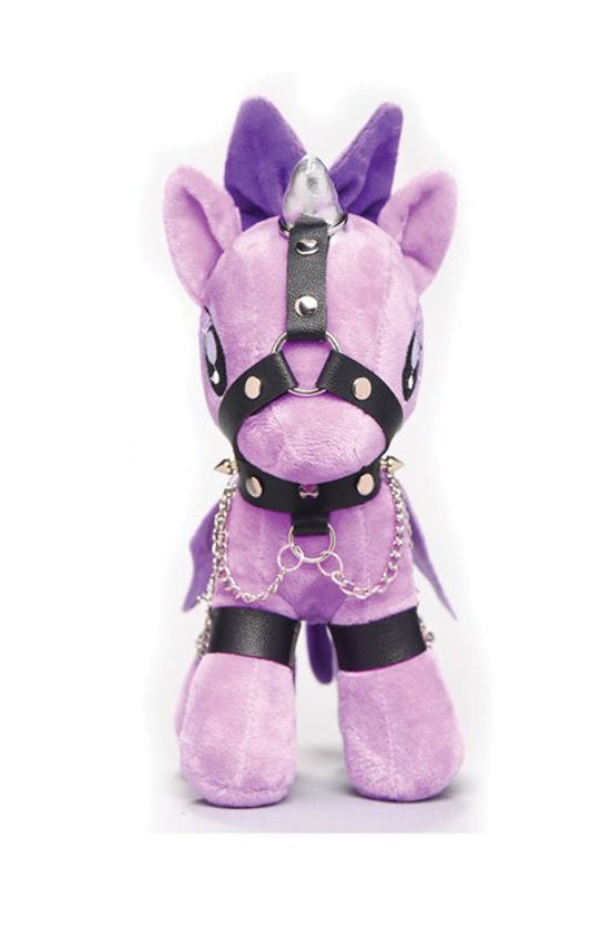 Front view of purple plush unicorn with black leather harness, studded collar, and silver horn against white background