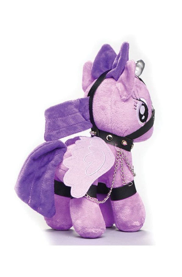 Back view of purple plush unicorn showing black harness straps, wing details, and cutie mark design