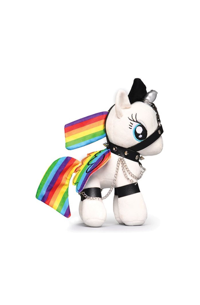 White plush unicorn with rainbow wings and mane, silver horn, black leather harness with chains and collar