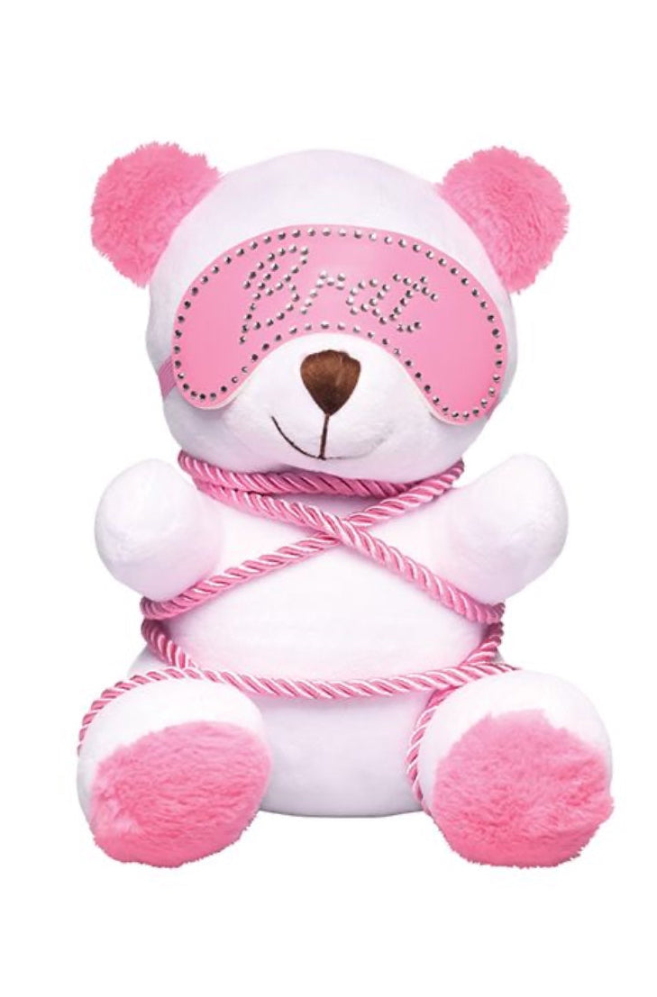 Back view of white plush bear with pink ears wrapped in pink twisted rope against white background