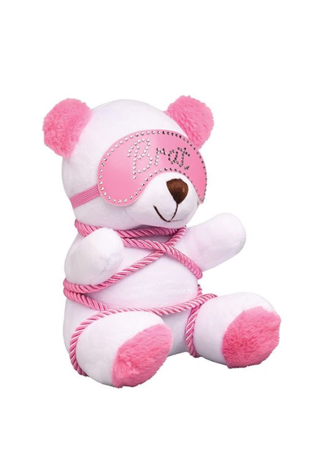 Front view of white plush bear with pink rhinestone Brat blindfold and pink rope bondage wrapping around body