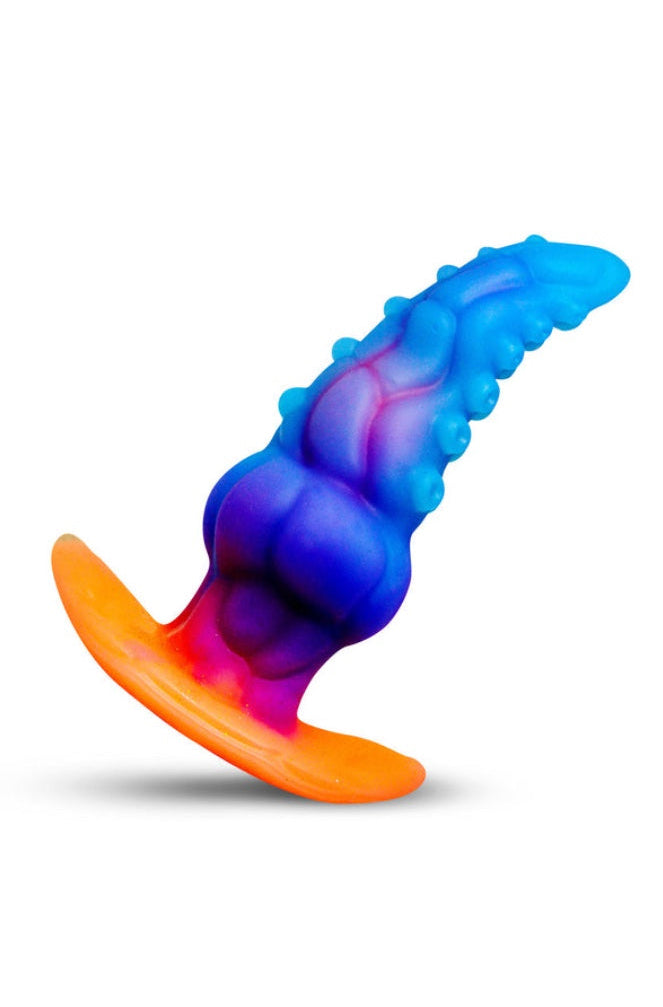 Front view of tentacle-textured anal plug with blue-to-purple gradient silicone shaft and orange flared base