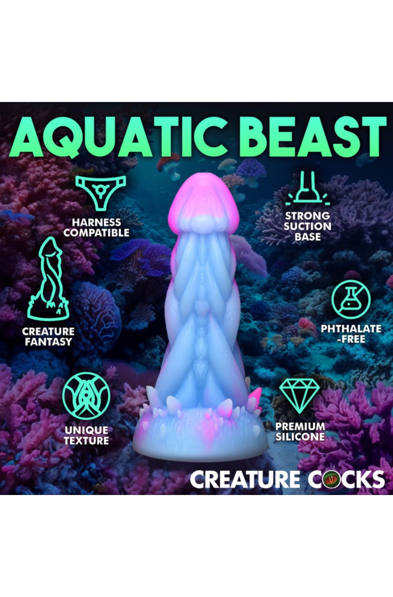 Blue pink jellyfish dildo features infographic highlighting harness compatibility and suction base over coral reef