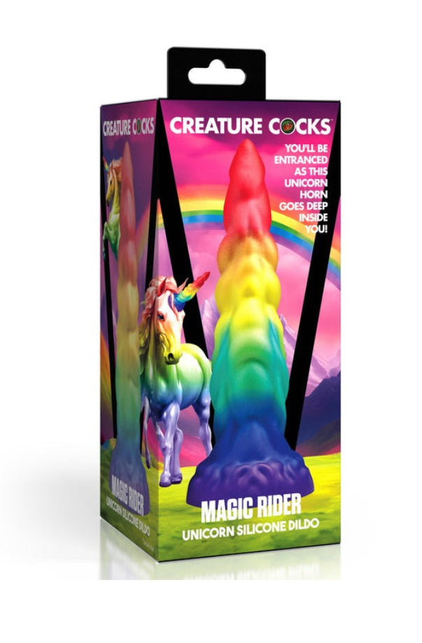 Product packaging showing Creature Cocks Magic Rider unicorn silicone dildo box with rainbow unicorn artwork