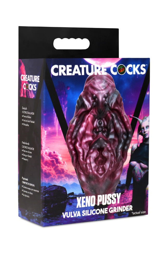 Red and black vulva grinder on cosmic purple background with product packaging