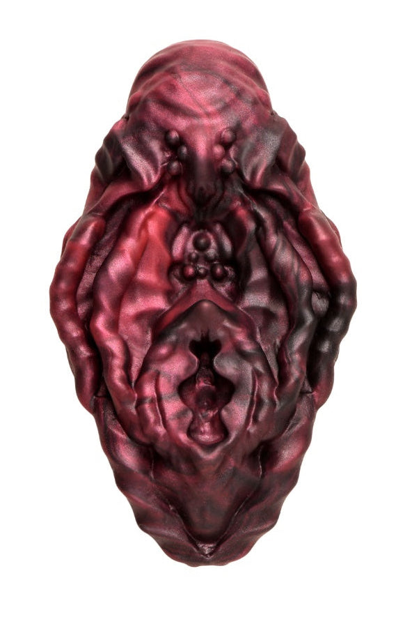 Top-down view of vulva grinder showing full textured surface with beads and valleys