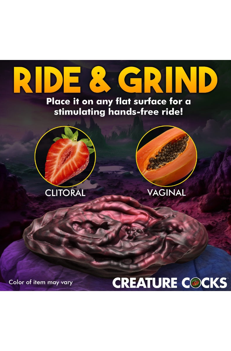 Side profile of vulva grinder on flat surface demonstrating grinding position