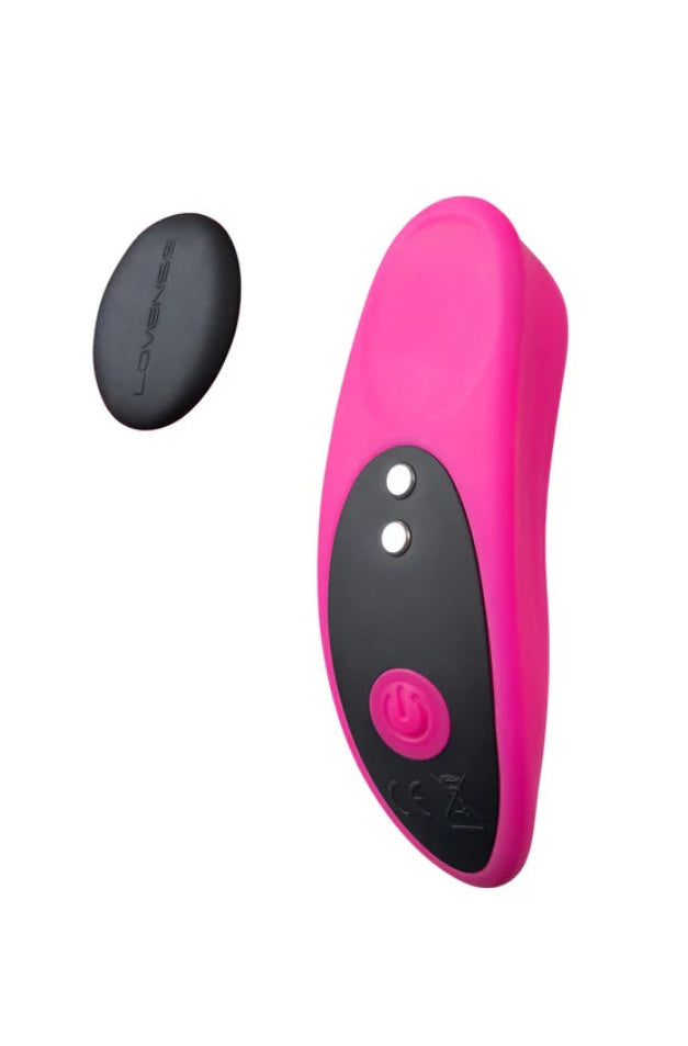 Pink curved panty vibrator with black control panel and separate black magnetic cap