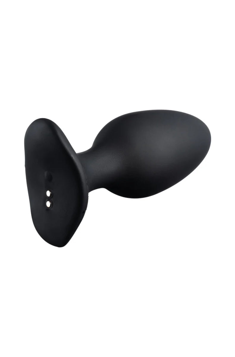 Side view of black butt plug showing oval-shaped body with narrow neck and flat base with two indicator dots