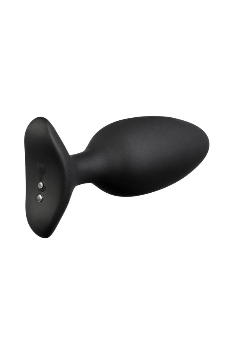 Side view of black silicone butt plug showing flared base with two small charging ports